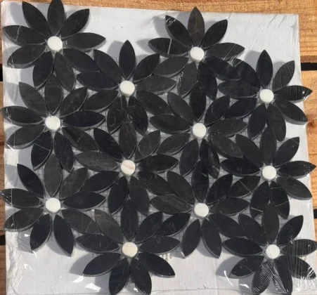 Black floral mosaic tile pattern with white centers
