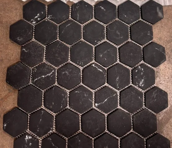 Dark black hexagon tile with marble veining