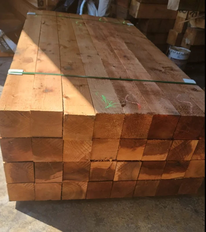 Stacked cedar posts and heavy lumber
